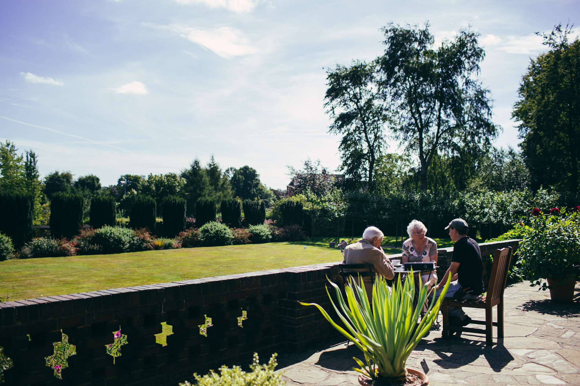 Friends enjoying afternoon tea on the terrace